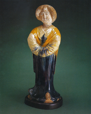 Tang dynasty figure of a standing court lady, featuring a rare deep blue glaze. This eighth century
ceramic figure was a prized possession of Mr. Rockefeller’s mother, and was later displayed in Mr. Rockefeller’s office at 30 Rockefeller Plaza. Credit: David Rockefeller Collection.