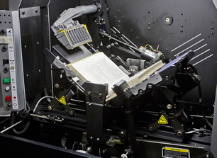 Close up of the Kirtas digital scanning machine, which has a 120-degree cradle with a 2.5-inch vacuum arm with pressurized air to turn the pages automatically. This machine is owned and operated at AAS by Readex.