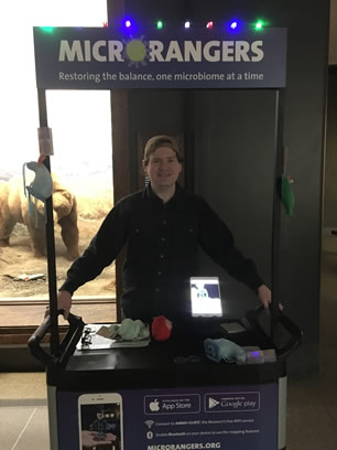A MicroRanger Guide and the MicroRangers cart in the Hall of North American Mammals.